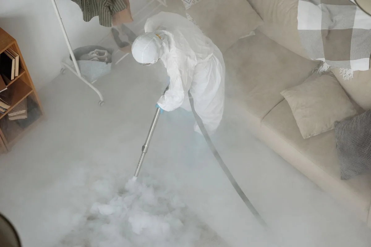 Biohazard cleanup technician in protective equipment, Demopolis, AL